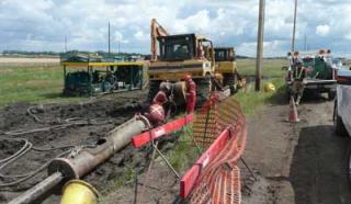 A Clean Harbors crew is extracting a 500-foot section of 8-inch steel piping with a 12-inch directional boring air pneumatic hammer. Thumbnail